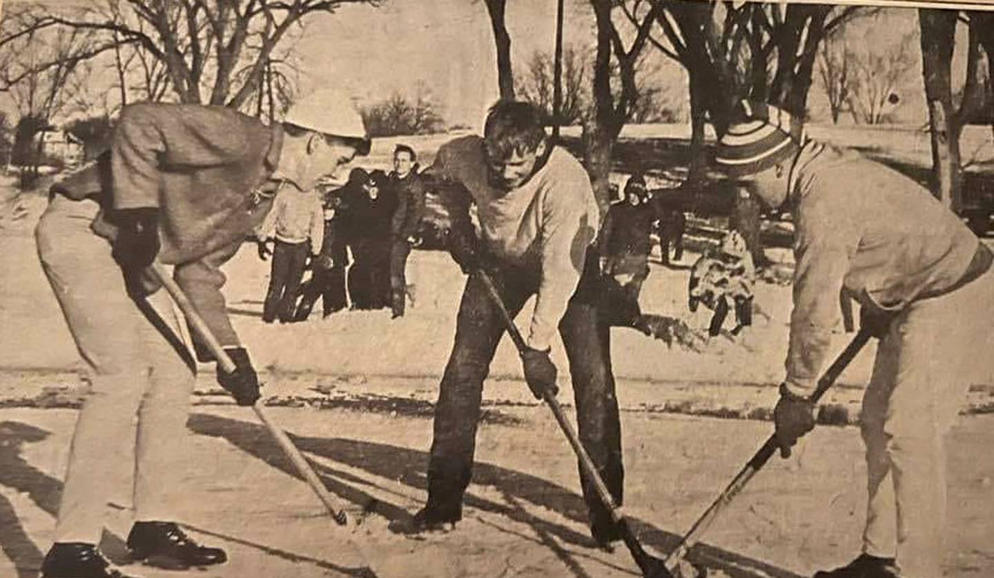 A group of Creston teenagers play a game of hockey on a frozen McKinley Lake New Year's weekend in 1966.