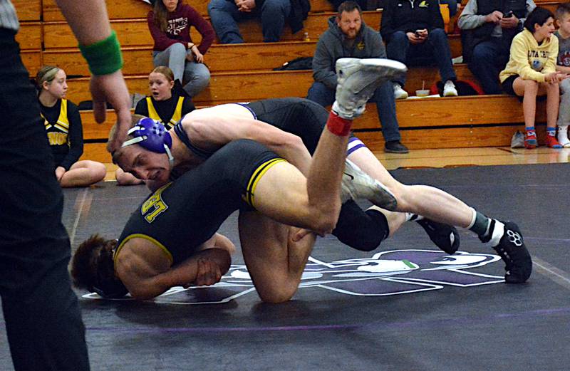 Nodaway Valley senior Matthew Nelson finishes a takedown against Lenox's Caden Kaufman at 157 pounds last Thursday night. Nelson won the match with a pin in 1:41.