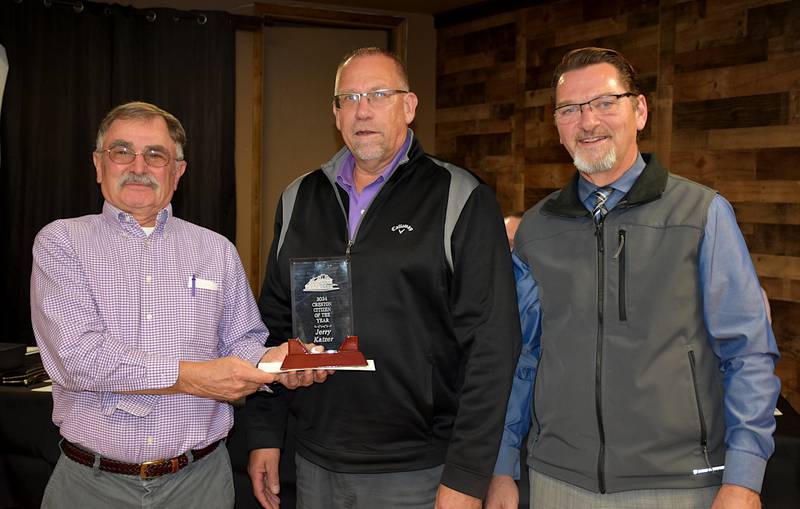 Dr. Jerry Katzer, left, receives the Creston Chamber of Commerce Citizen of the Year award from chamber member Craig Mittag and chamber board president Bruce Pearson.