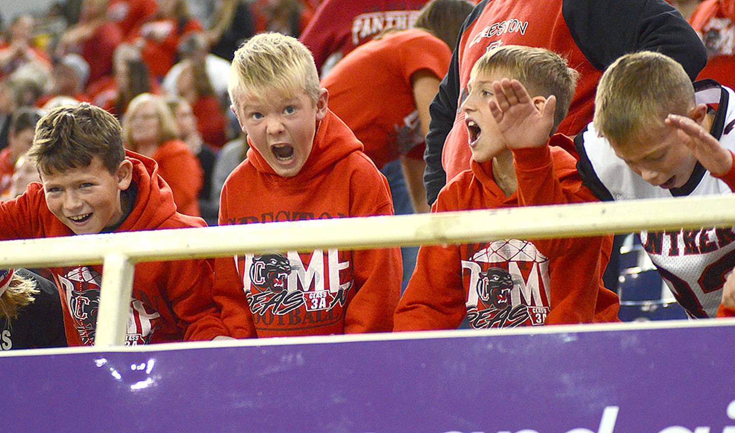 Young Creston Panther fans shout a chant in support of the team's defense during Saturday's semifinal game.