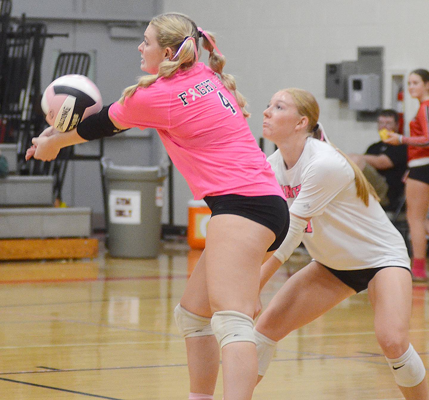 Creston's Ella Turner (left) receives a St. Albert serve. Libero Avery Staver is shown at right.