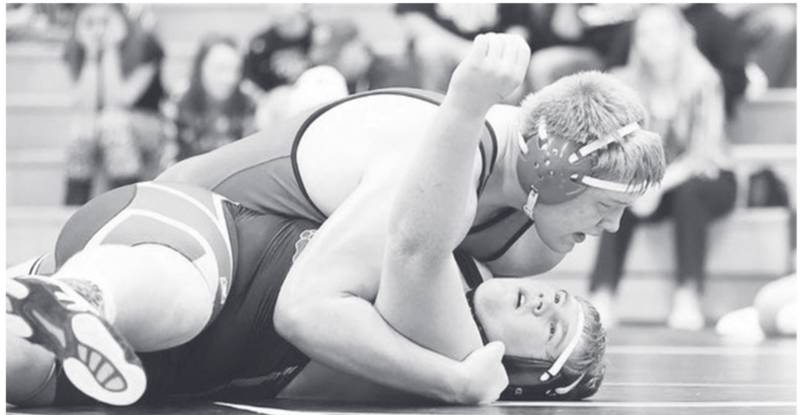 Creston/O-M senior heavyweight Blake Sevier puts Nodaway Valley's Jory Christensen in a near pinning predicament.