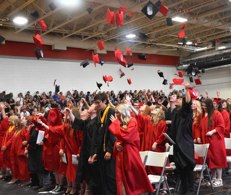 The class of 2025 throw their caps in celebration following the commencement ceremony Sunday afternoon.