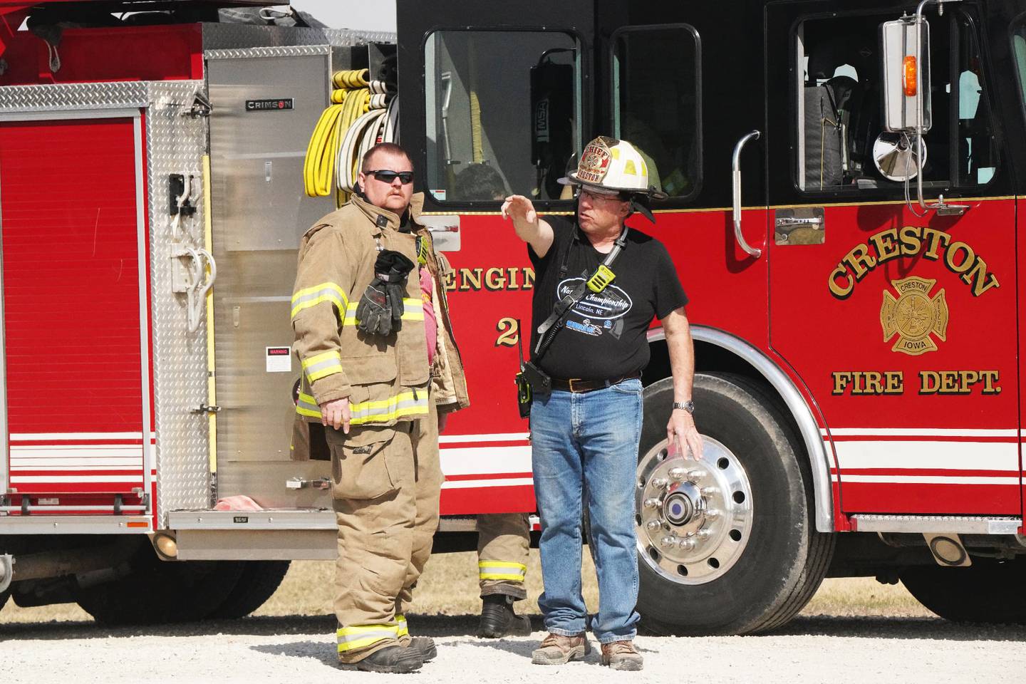 From left, CFD Assistant Fire Chief Daniel Stull and Fire Chief Todd Jackson commune during an out of control county fire Wednesday.