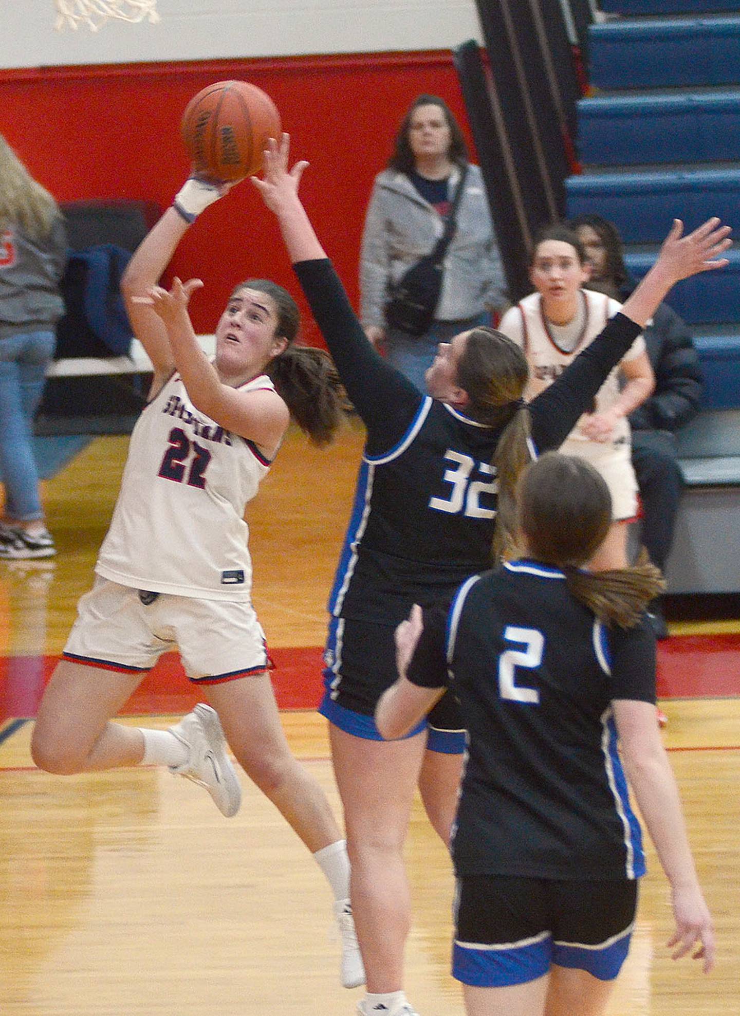 Southwestern's Nora Olana releases a shot near the basket against defender Ella Stoskopf of NIACC Saturday.
