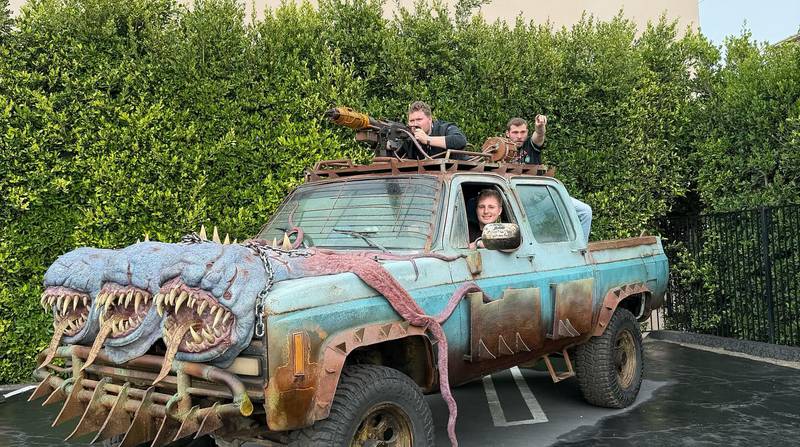 Evan Nielsen (stationed in the vehicle's mounted gun) celebrates the launch of "Black Ops 7" with friends from the development team. The custom vehicle, modeled after an in-game truck, was built to celebrate the launch.