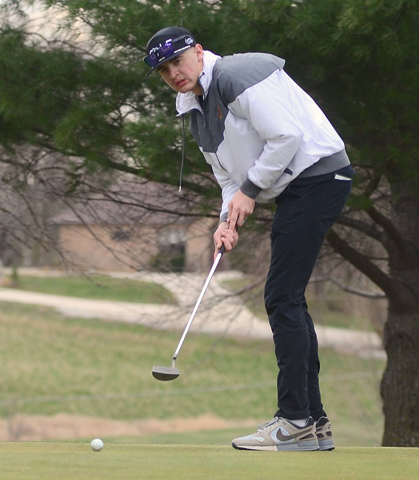 Jake Hoyt guides a putt toward the cup on No. 3 at Crestmoor Thursday in the meet against Atlantic.