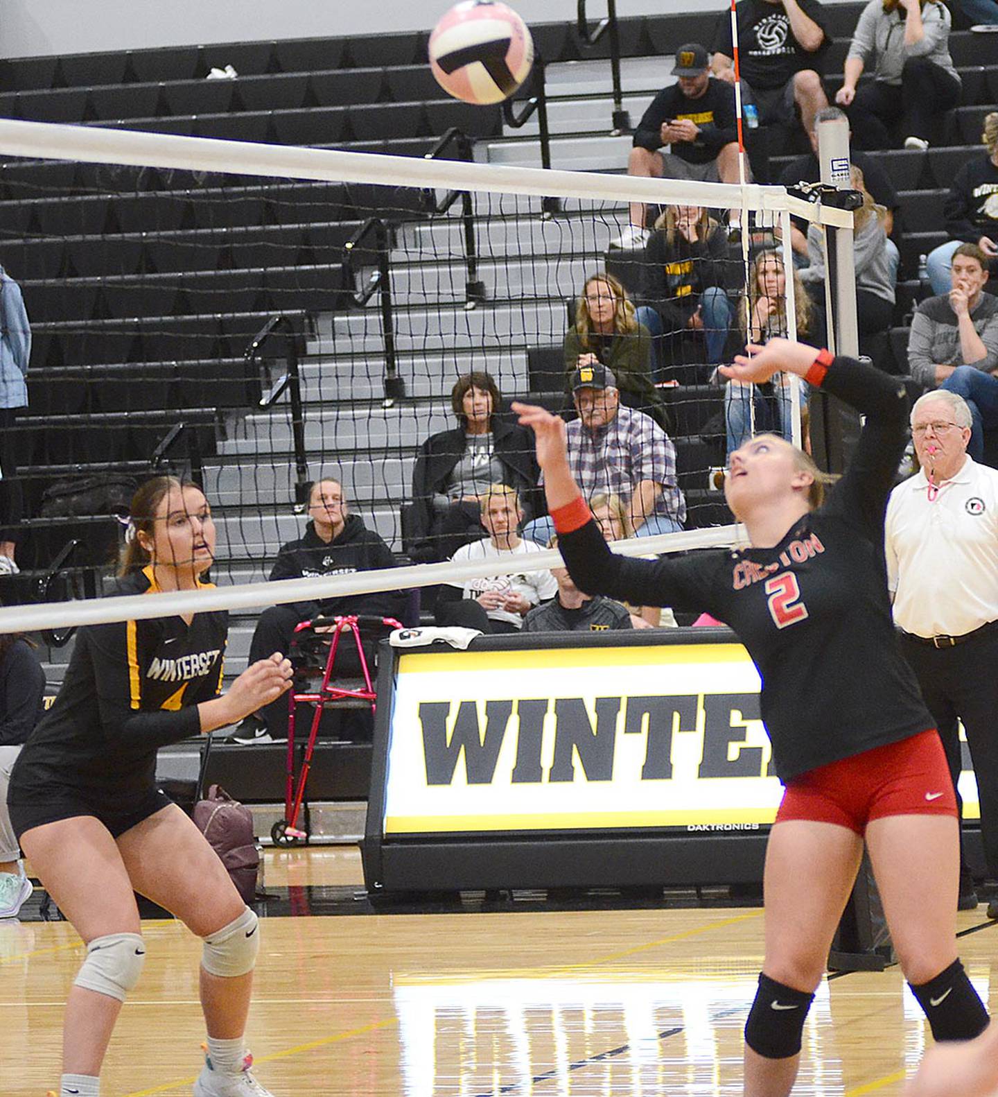 Creston setter Hollyn Rieck (2) sends a setter dump across the net Tuesday against Winterset. Rieck had four assists, six digs and two kills in the 3-0 loss.
