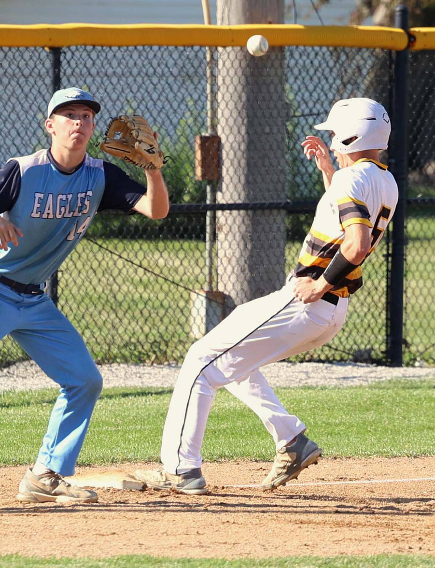 Gabe Funk goes into third base standing up for one of his school-record 56 stolen bases this season. His total topped all Iowa players from all four classes.