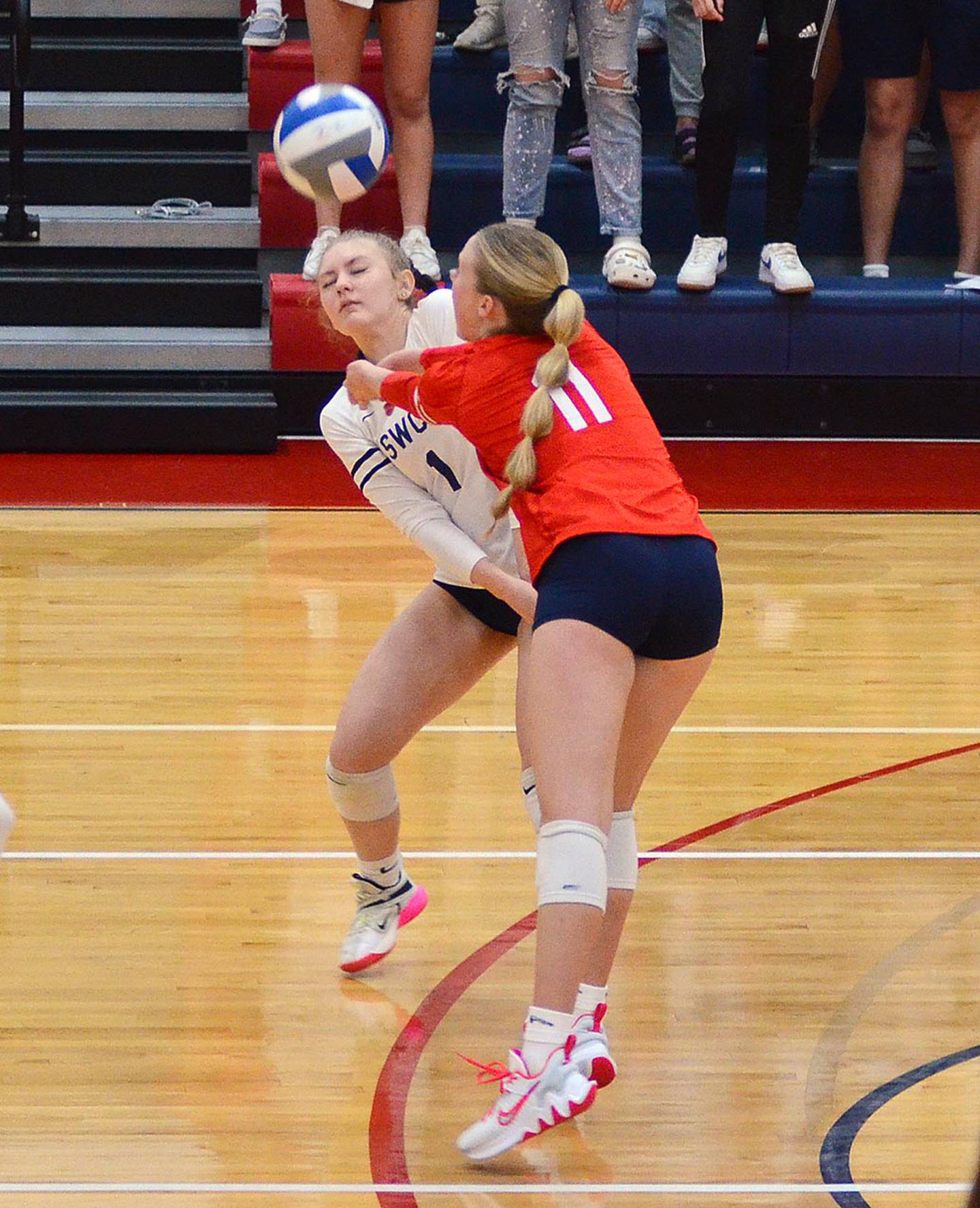 Emily Strait (11) and Lexi Hahn (1) converge on a serve reception against Hawkeye Community College. Strait and Hahn each had nine digs to lead the Spartan defense.