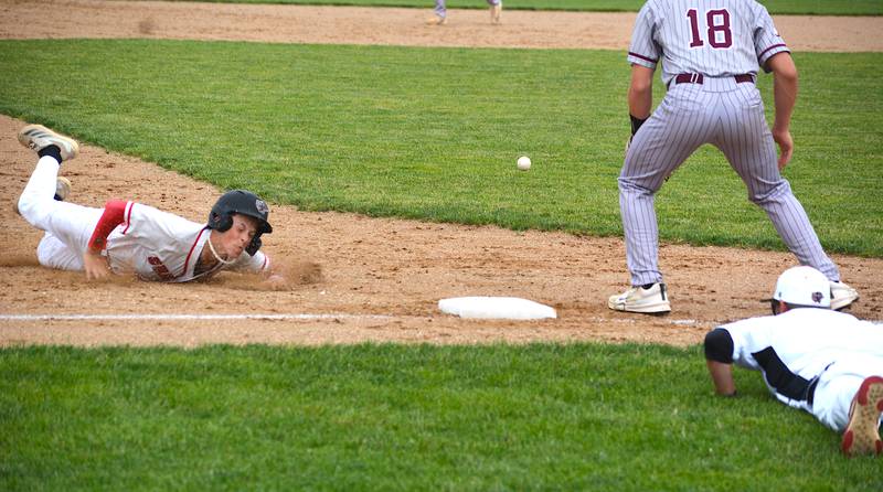 Creston freshman Landyn Scherer, courtesy running for catcher Tom Mikkelsen, slides into third at the bottom of the third inning Tuesday in a 5-0 home win over Shenandoah.