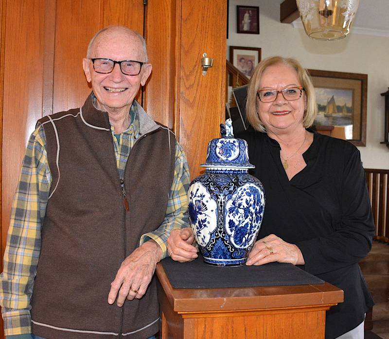 Jack and Marijke Brown with a Delft Blue piece of Dutch pottery in their home in Greenfield.