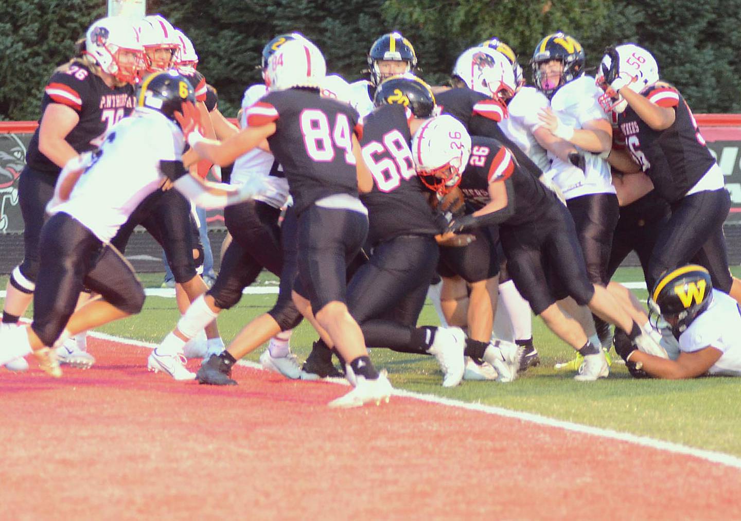 Creston running back Jackson Pettegrew scores the first of his four short-yardage touchdowns Friday, following the blocks of Jameson McDonald (84) and Layne Sand (68). Pettegrew rushed for 173 yards on 33 carries.