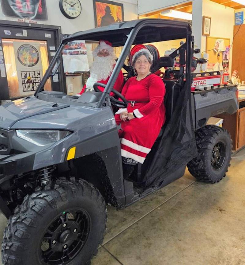 Santa and Mrs. Claus showcase Fontanelle Fire and Rescue's new Polaris UTV, which Fire Chief Tyson Sickles says will aid the department in getting to harder-to-reach places.