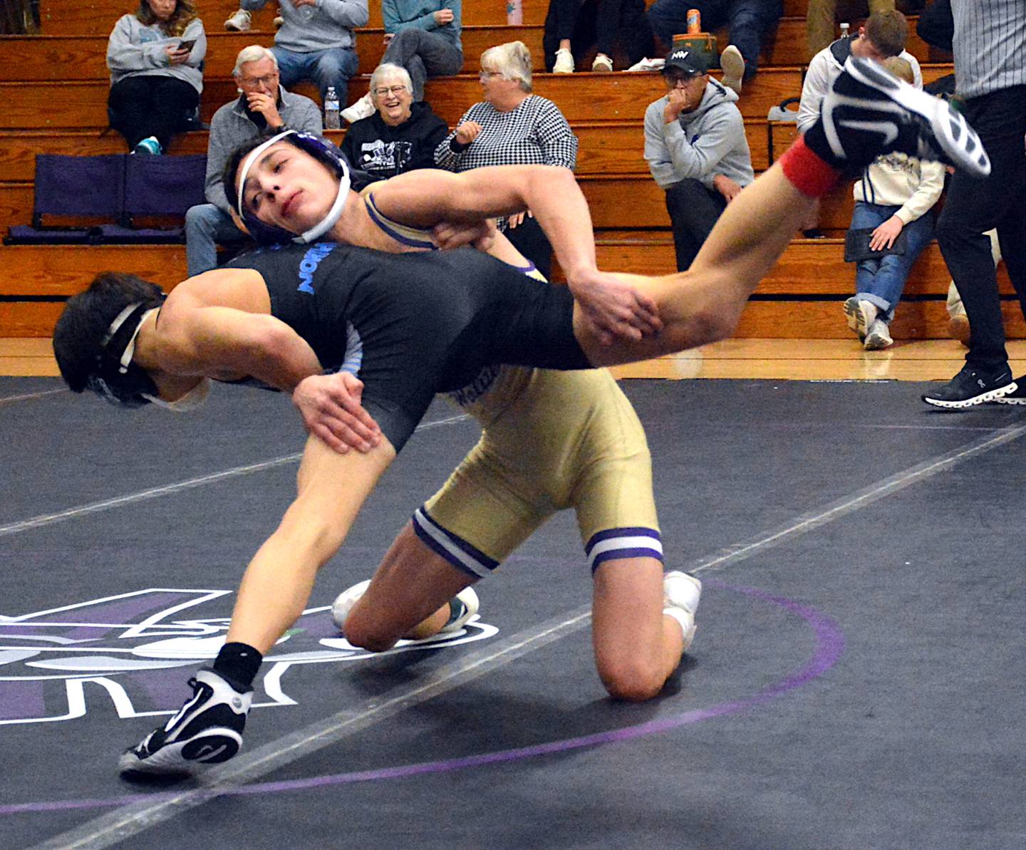 Josh Nelson works a double leg takedown in his finals match at last Saturday's Coach Riley Invitational.
