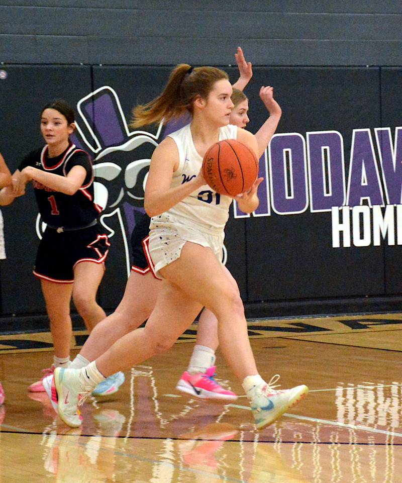 NV senior Kacie Ford plays against Earlham Saturday afternoon, looking for the next open pass to make.