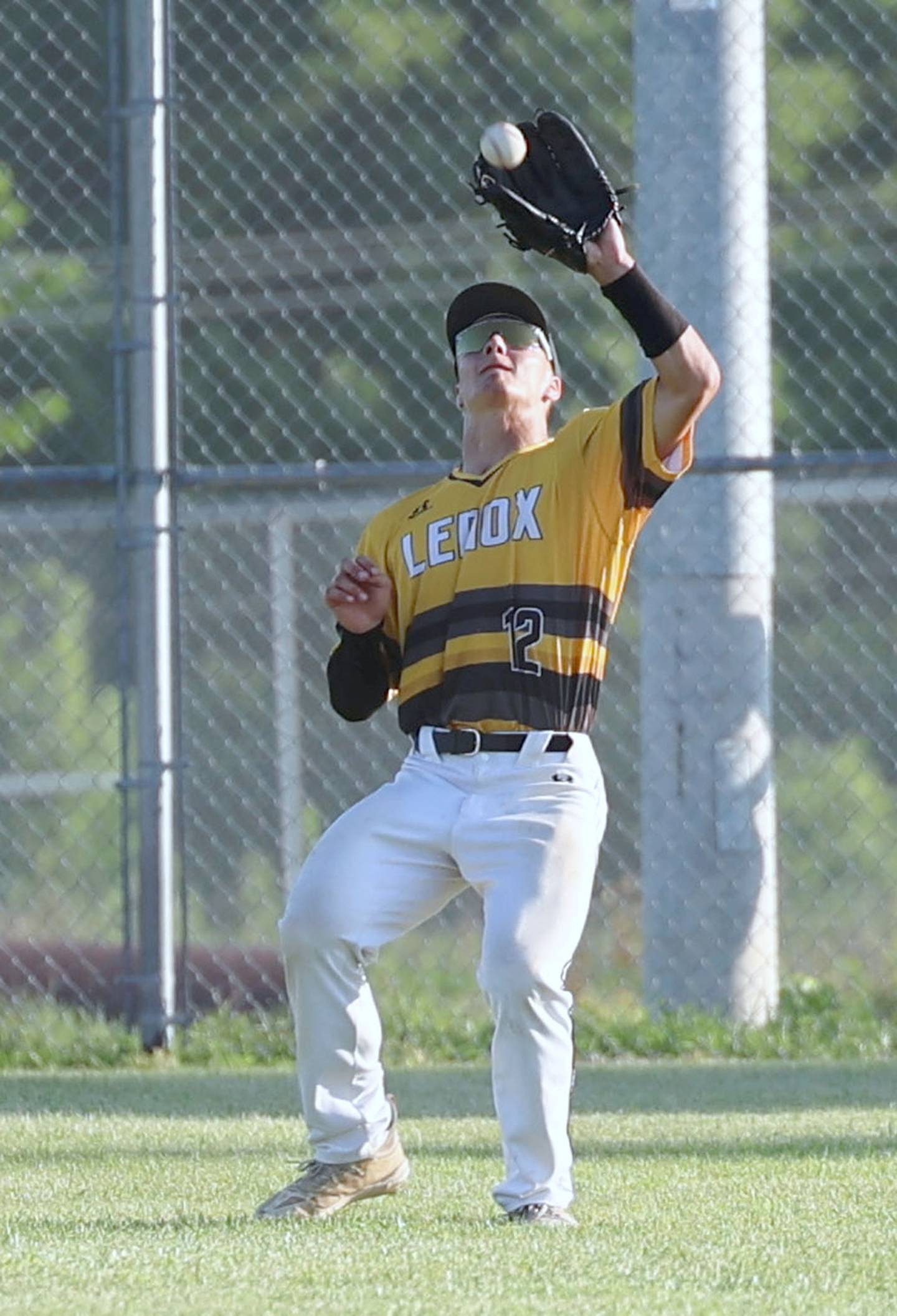 Lenox left fielder Jordan Martin-England makes the catch for the second out of the first inning against Martensdale-St. Marys in Tuesday's substate final.