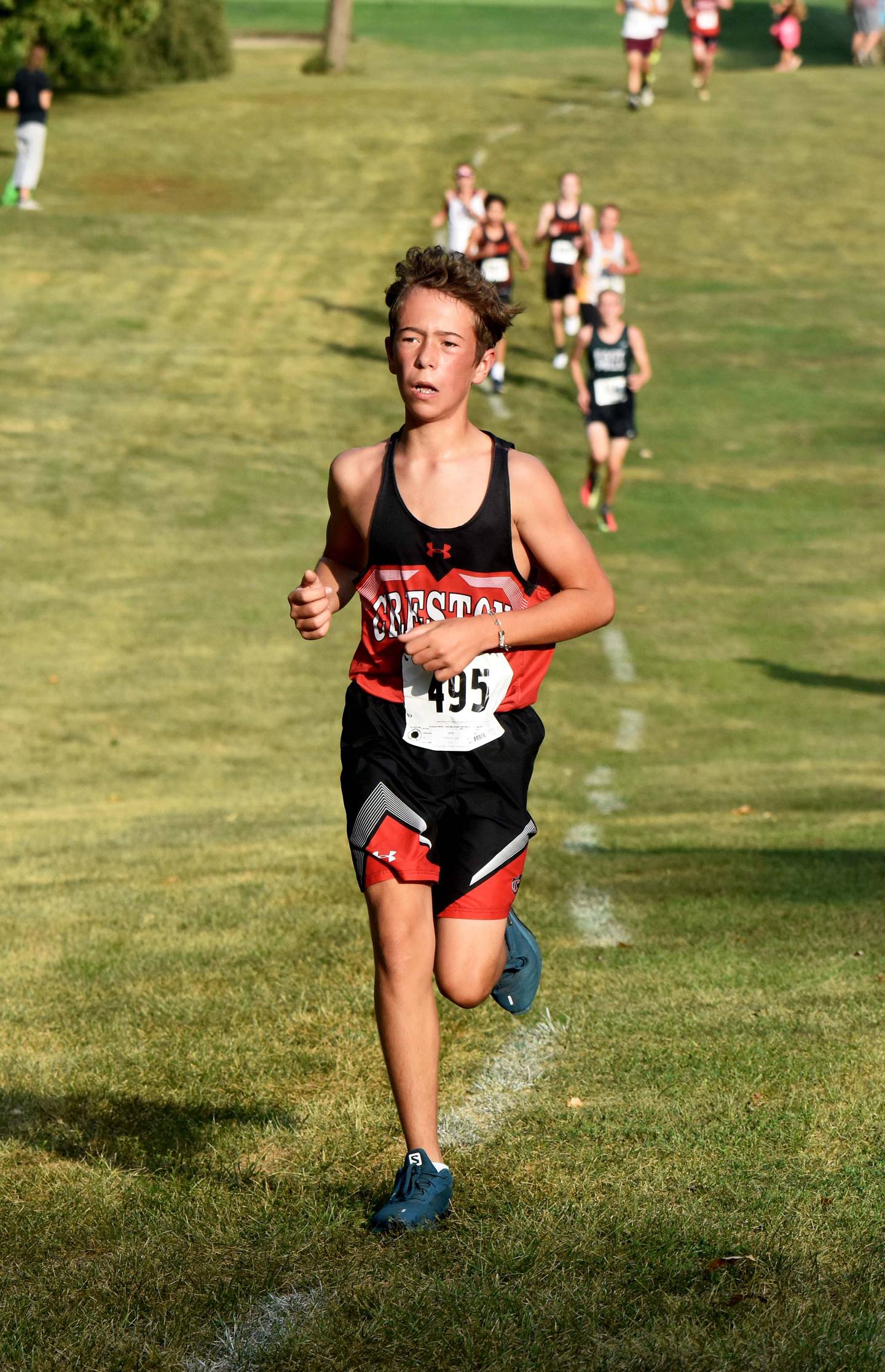 Freshman Wyatt Goodenberger digs in up a hill before finishing third for the Panthers, placing 20th in 21:39.22 to earn his first medal.