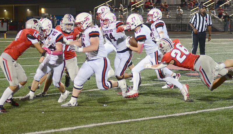 Harlan's Jackson Arhenholtz (26) makes a diving attempt to tackle Creston running back Gabe Kaufman (27) as the Panther freshman follows blockers Jackson Pettegrew (25), Gunner Martwick (76), Jameson McDonald (84), Chasse Downing (67) and Riggins Hanson (11). Kaufman rushed for 81 yards, including a 44-yard touchdown.