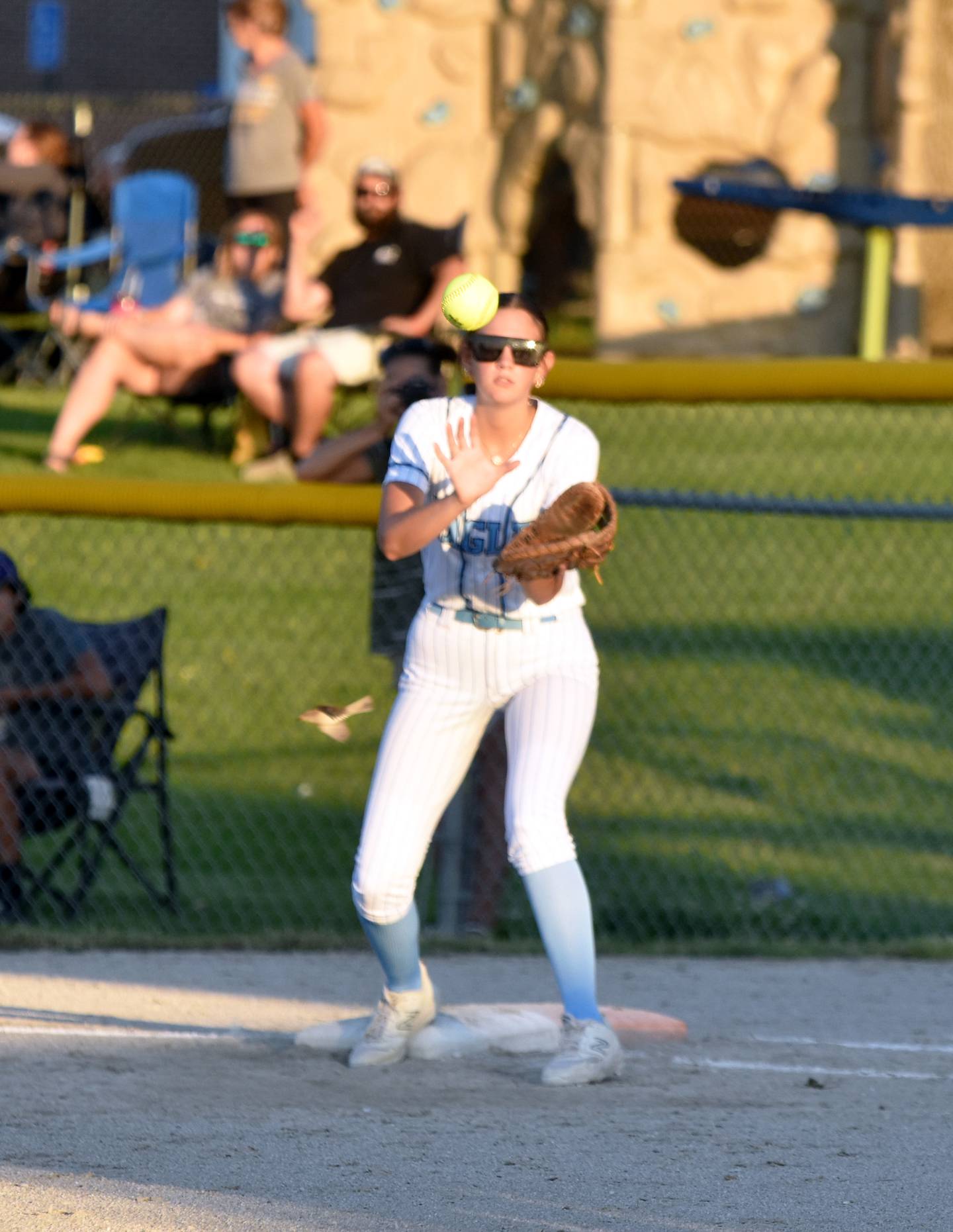 Eagles first baseman Hailee Willets catches a ball for an out at first.