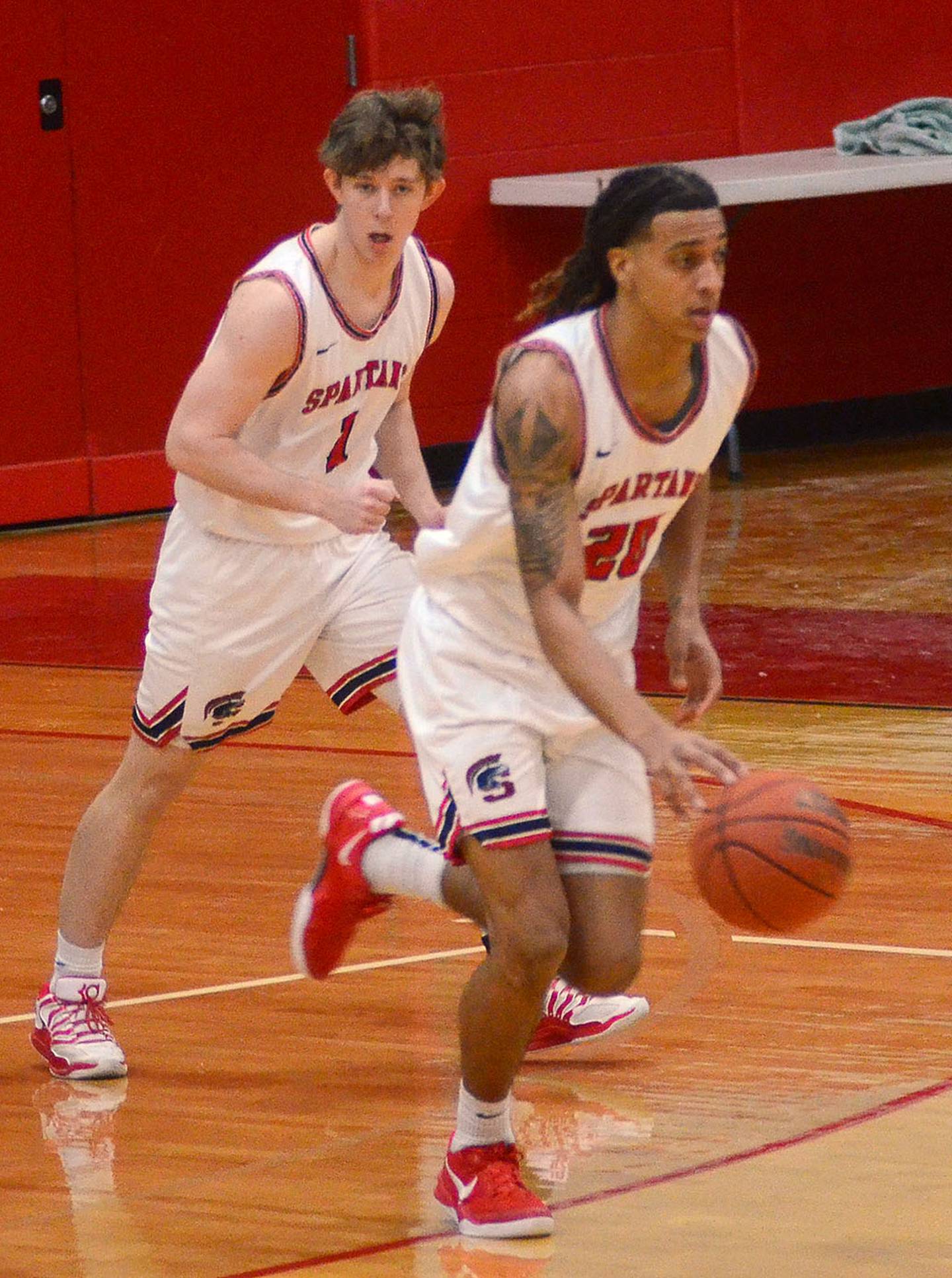 Southwestern's Myles Opare advances the ball on a Spartan fast break against Iowa Central Saturday.
