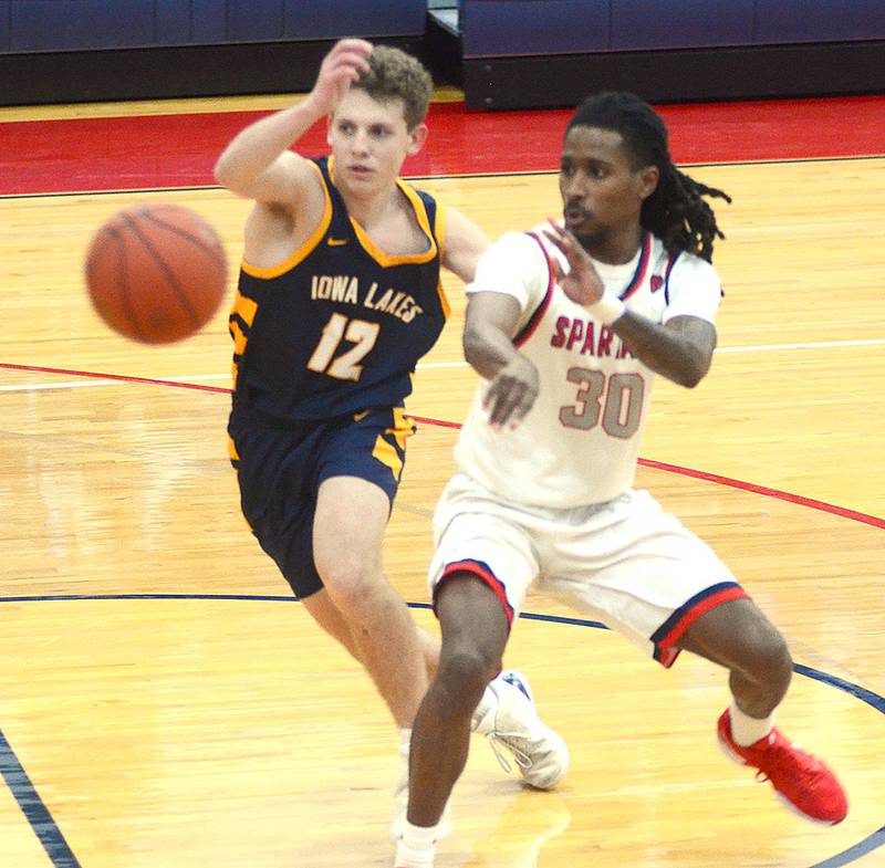 Southwestern point guard Niko Wilson slips a pass to a teammate during Saturday's 81-79 victory over Iowa Lakes. Wilson had 16 points, four assists and six rebounds.