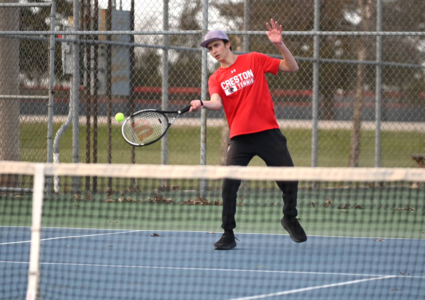 Tim Bartlett battles in extra games against Fred Harris in No. 2 singles, winning 9-7.