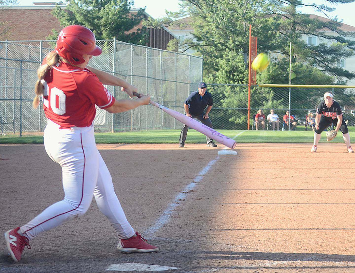 Nevaeh Randall connects on a home run to center field in the second game against Benedictine College Wednesday.