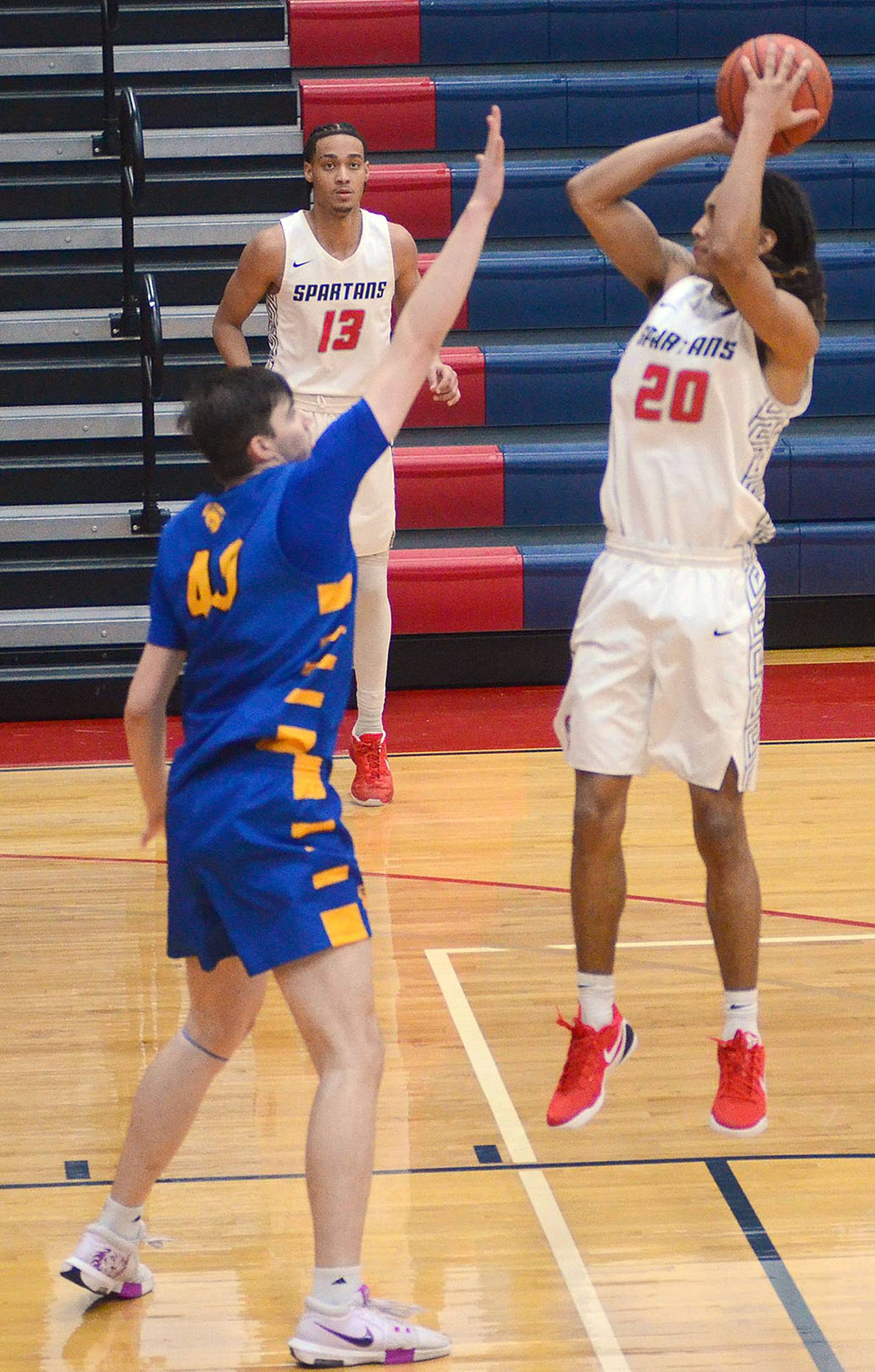 Southwestern's Myles Opare shoots over a NIACC defender during Saturday's game. Opare scored 10 points in the 81-71 loss.