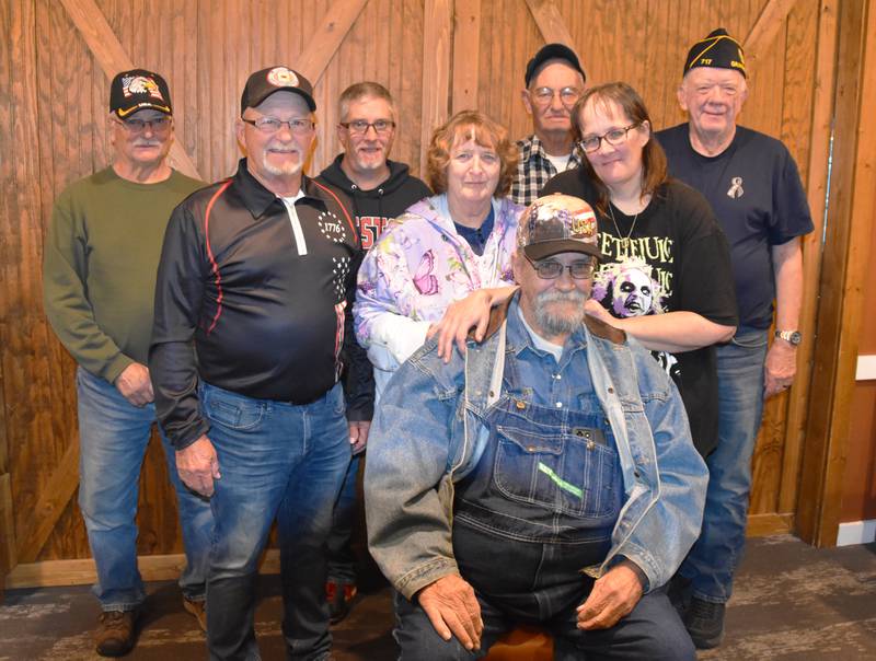 A group of veterans and friends surprised Fred Solt, front, Oct. 22 at Pizza Ranch in Creston, where he was able to meet his daughter Kelly Cochran, second row, right, for the first time. His friends Anita (second row middle) and Lenny Thompson (back right) were the masterminds behind the meeting.