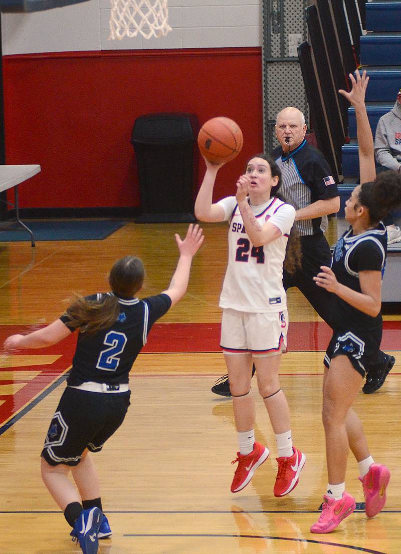 Malania Rodriguez of Southwestern puts up a close-range shot against Peru State JV Monday night. The Spartans broke away for a 63-42 victory after trailing 21-20 at halftime.