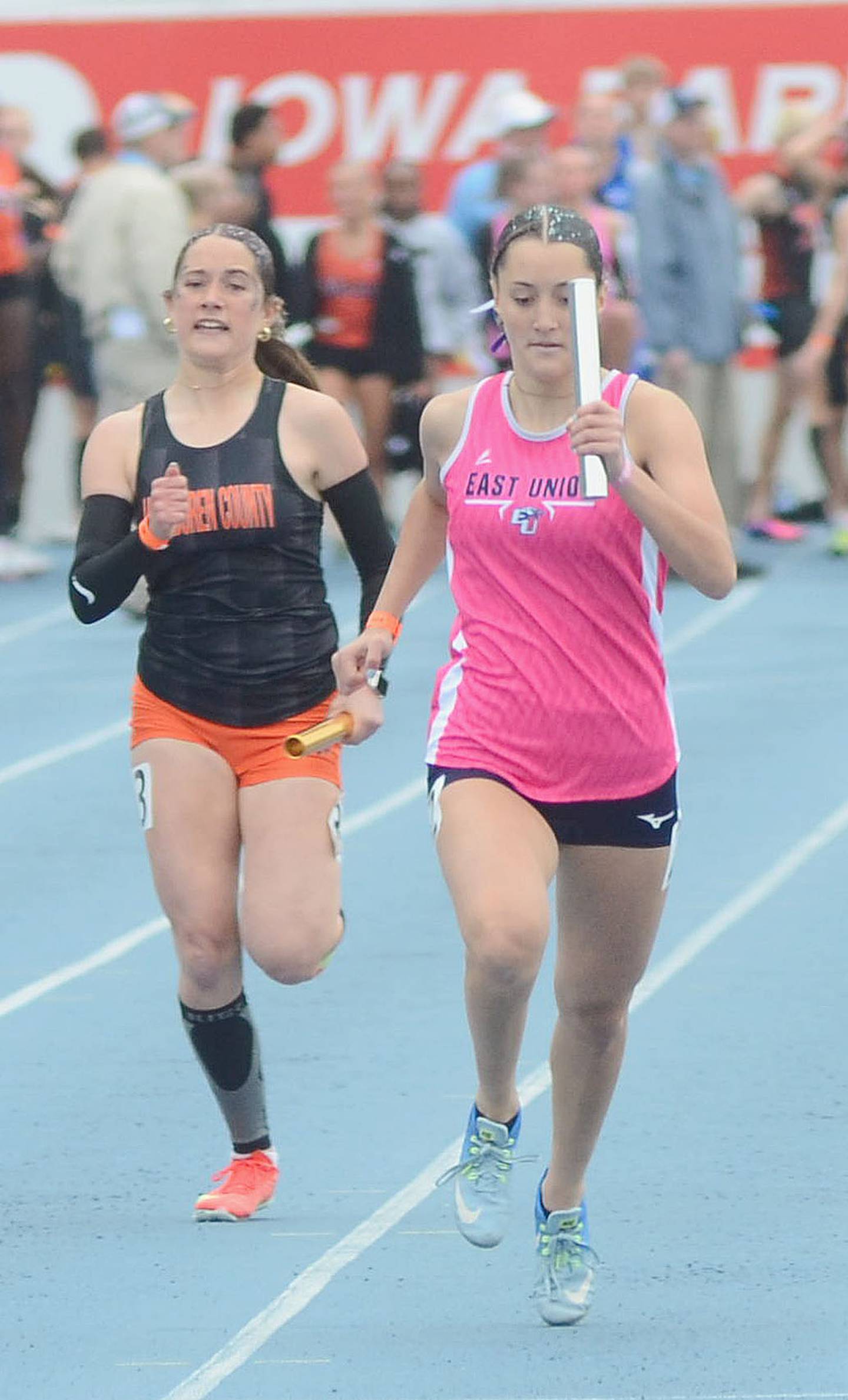 East Union's Marissa Cass (right) carries the baton on the anchor leg of the 4x200 relay Friday morning. The team of Tristin Lear, Maria Long, Rebecca Young and Cass finished 11th in 1:48.59.