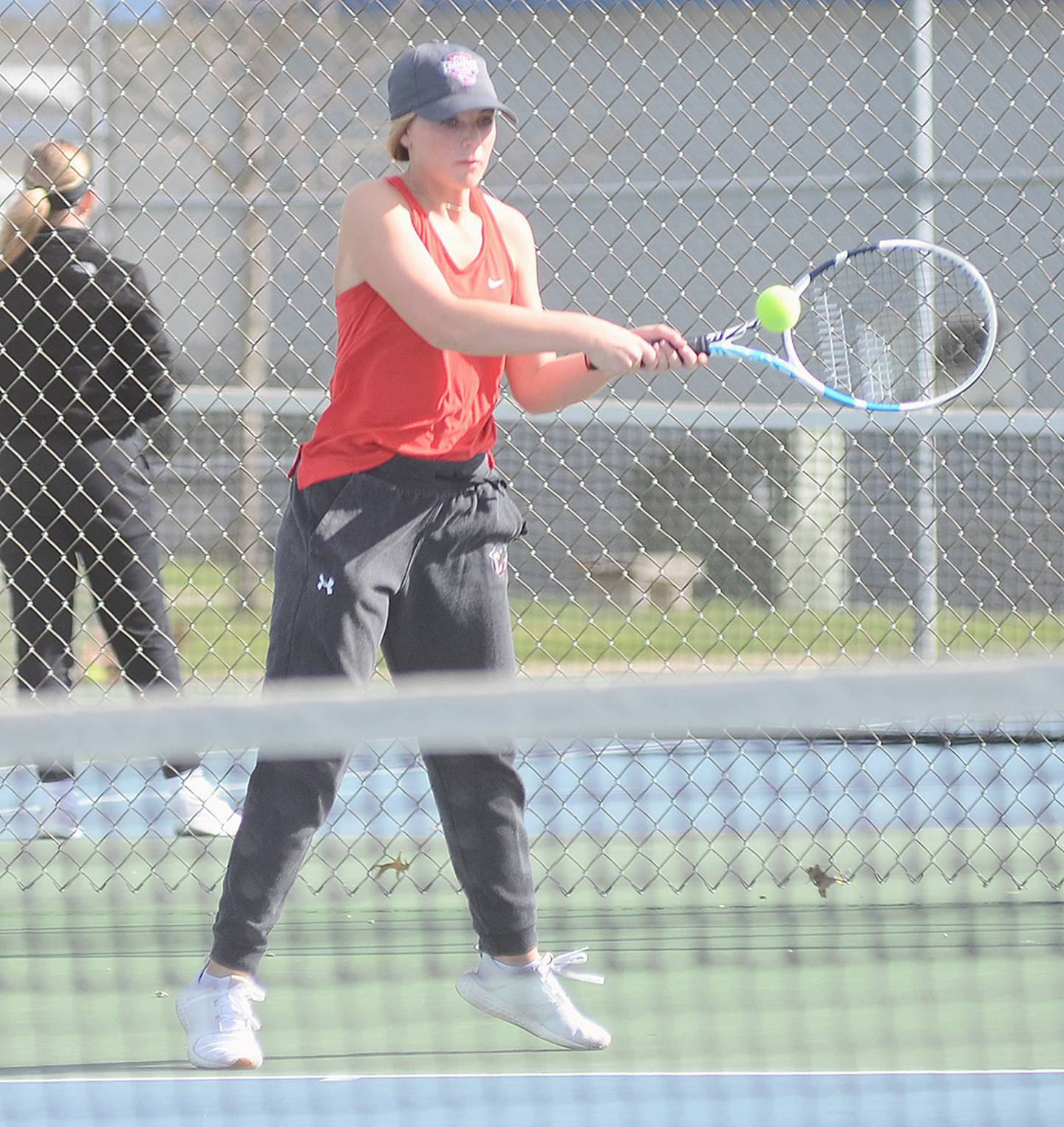 Creston's Sasha Wurster returns a backhand baseline shot against Red Oak during her 8-3 win at No. 3 singles Thursday.