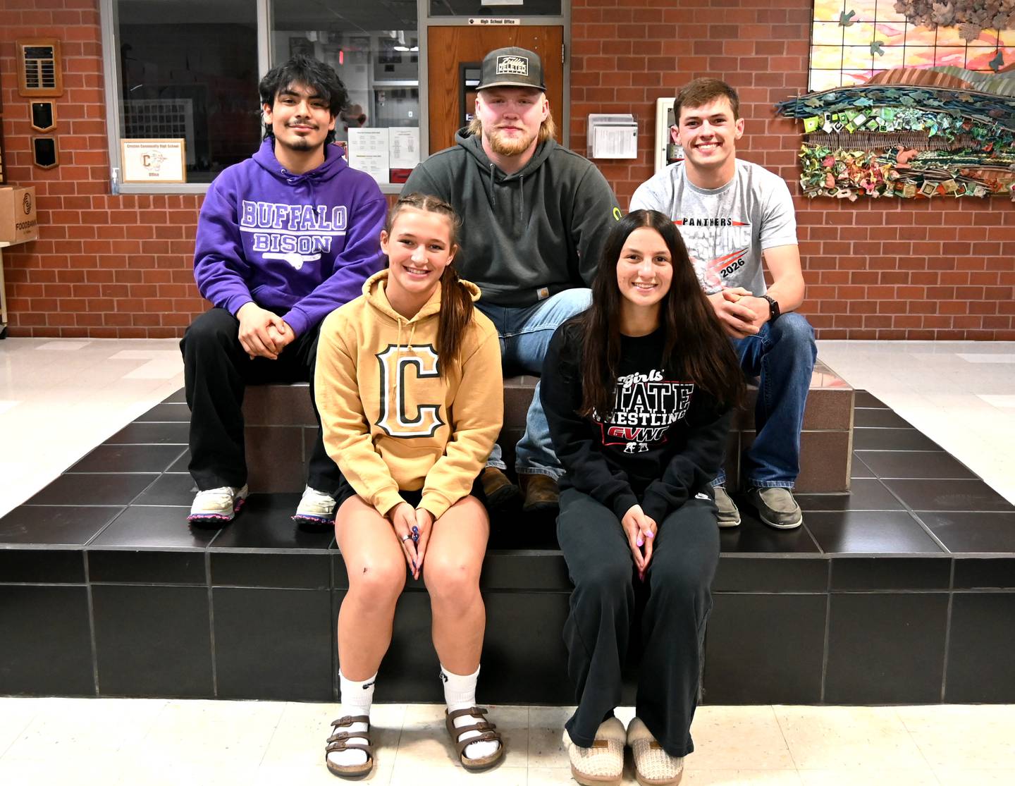 2026 wrestling state qualifiers. Front row, from left: Alainah Galanakis, Grace Keeler. Back row: Jose Avila, Gunner Martwick, Lane Travis.