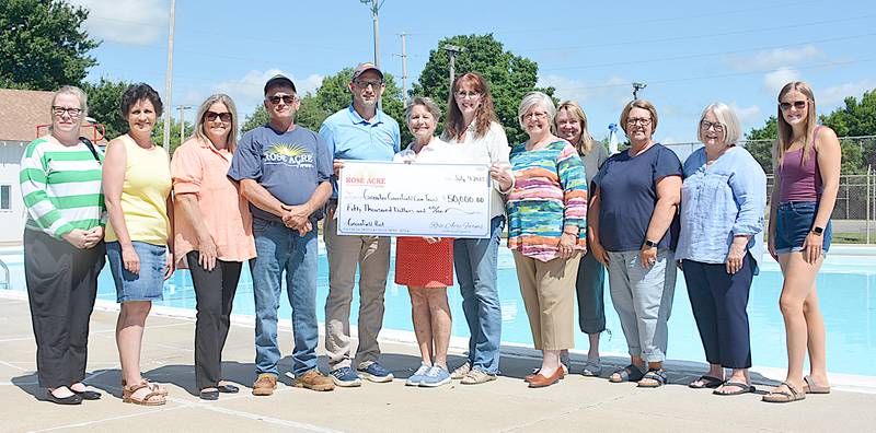 Representatives of the City of Greenfield, Greater Greenfield Community Foundation and the two committees working with the pool received a $50,000 donation, directed toward GGCF for improvements to or replacement of the pool.