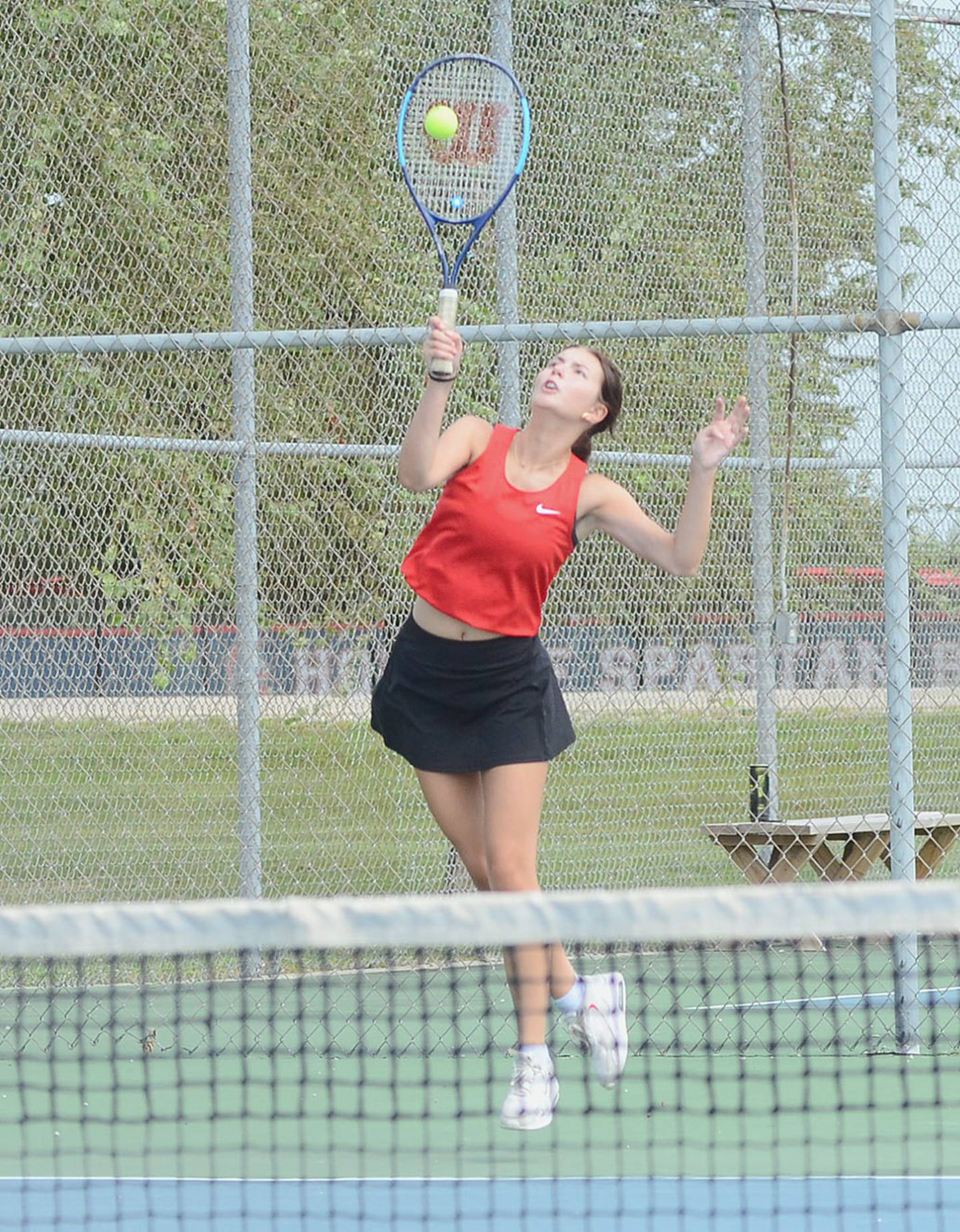 Savannah Jaques of Creston hits a serve against Audubon on Thursday. Jaques won 8-6 and fell 8-6 in a tiebreaker against Audubon on Friday for the Panthers.