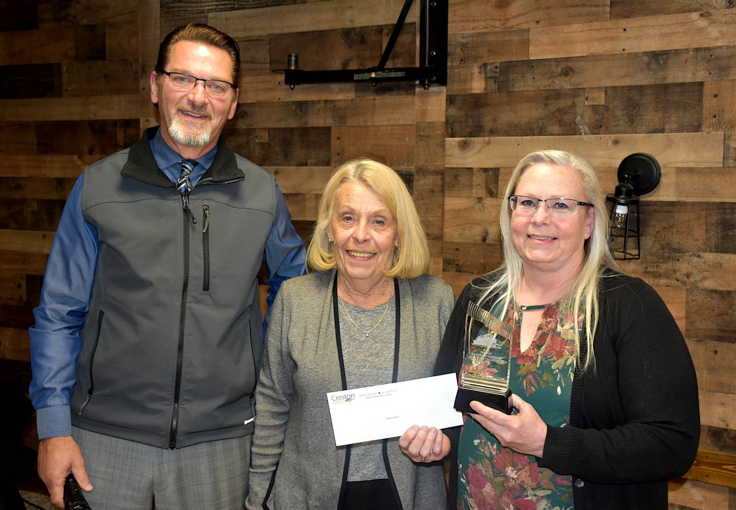 Karen Drake, right, accepts the Creston Chamber of Commerce Volunteer of the Year award from Pearson and Creston Chamber of Commerce Executive Director Ellen Gerharz.