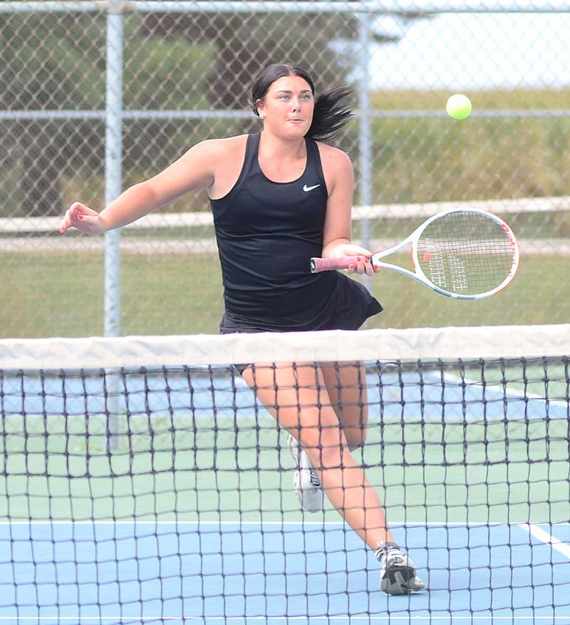 Kennedy Strider of Creston approaches a shot near the net during her No. 2 singles match against Atlantic.
