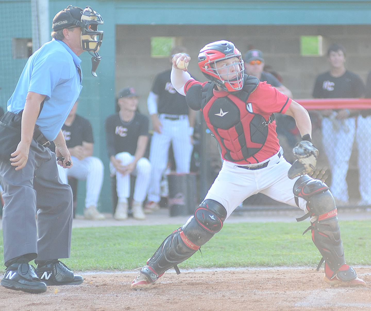 Creston catcher Milo Staver throws to second base on a Harlan stolen base attempt Monday.