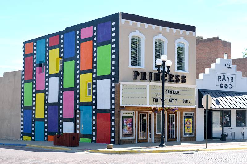 The Princess Theater, located in Mount Ayr on 101 W Monroe St. The mural on the side of the building was designed by Iowa State students in 2023. The marquee on the theater has been declared structurally unsound and will be need additional funding to repair.