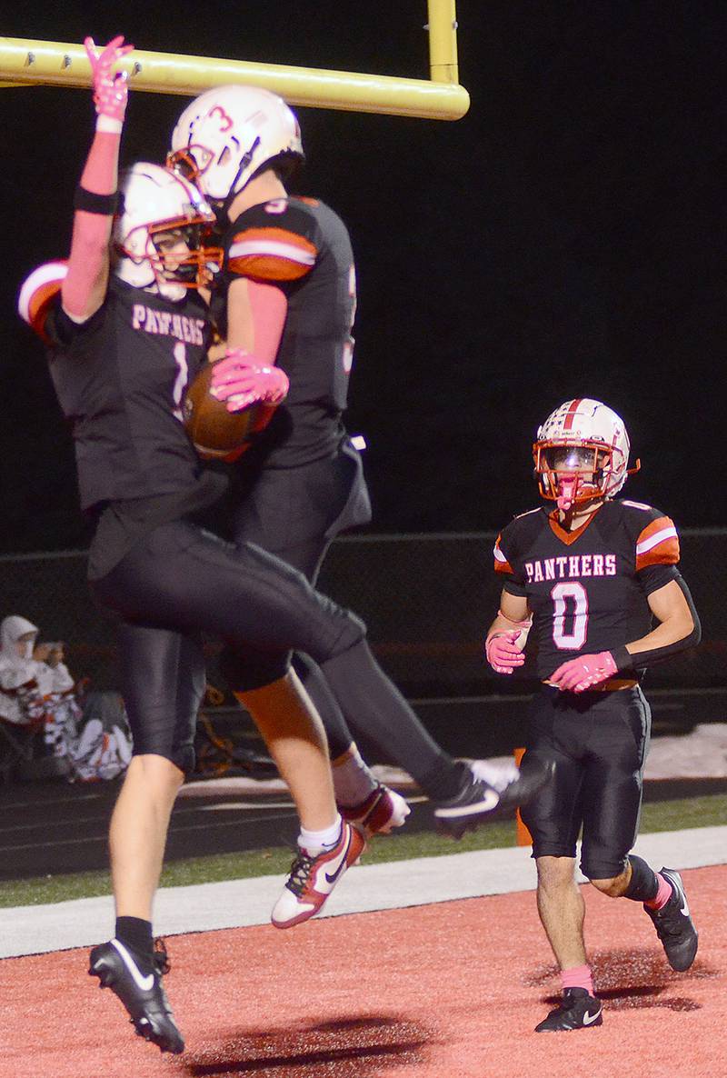 Rhett Driskell (3) celebrates with teammate Jace Purdum (1) and Seth Gordon (0) after Purdum's touchdown reception in the second quarter Friday. Purdum had seven catches for 117 yards and two TDs in the 42-35 victory, including the game-winner in the final seconds.