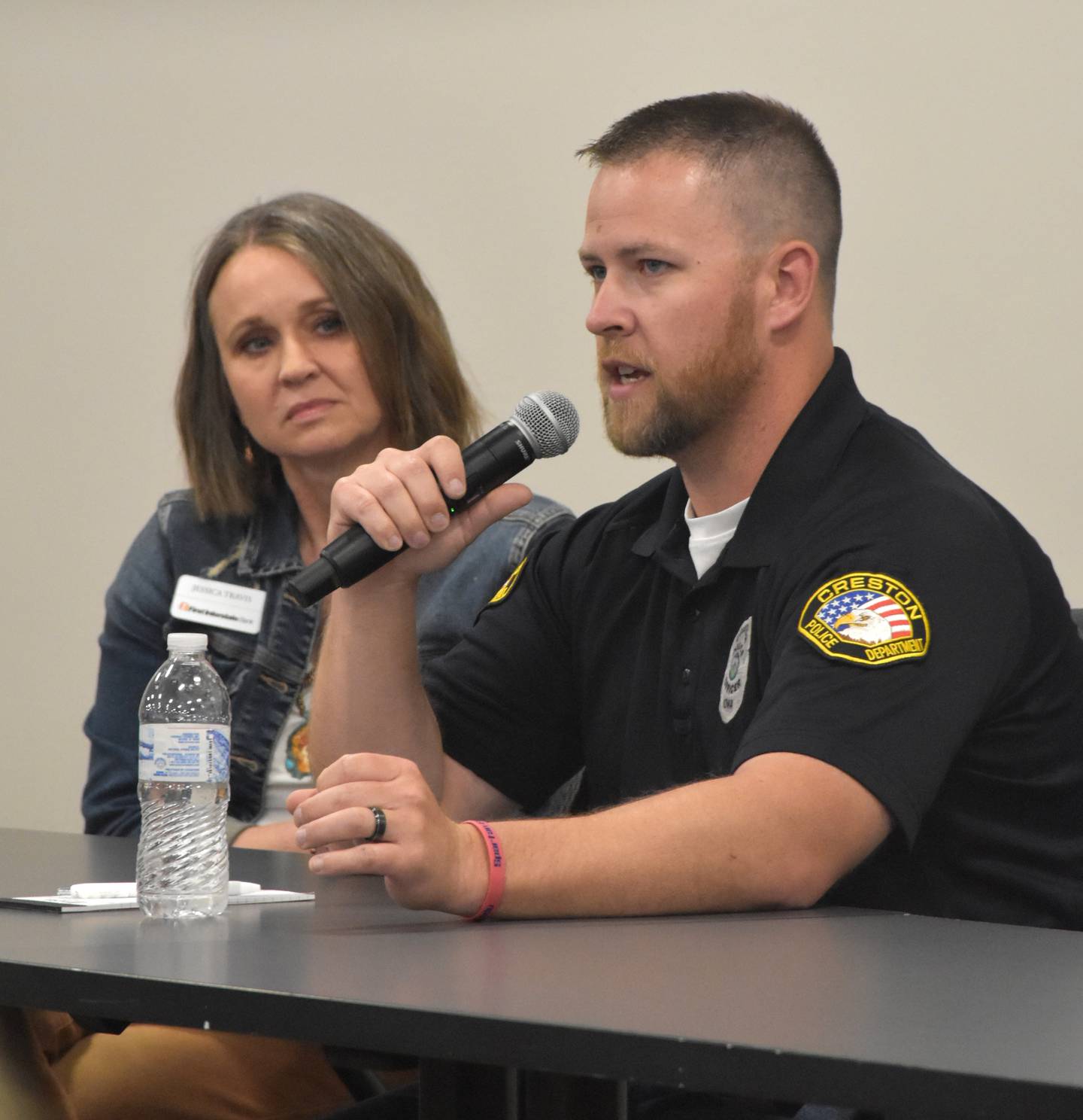 Creston Police Officer Cory Dorsey speaks during the Q&A portion of the fraud seminar Tuesday night.
