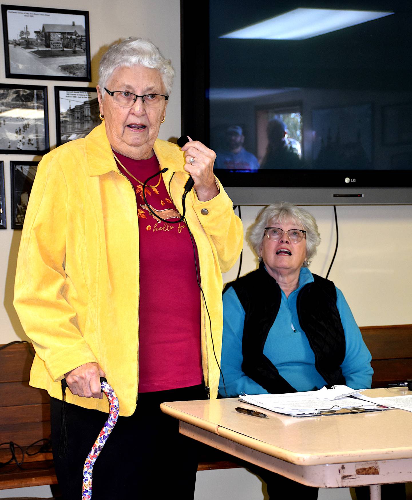 Midge Scurlock, left, tells her stories about attending Lincoln school during her youth. At right is Sharon Snodgrass, a member of the Union County Historical Society board. A time capsule from Lincoln was opened as the school is being demolished.