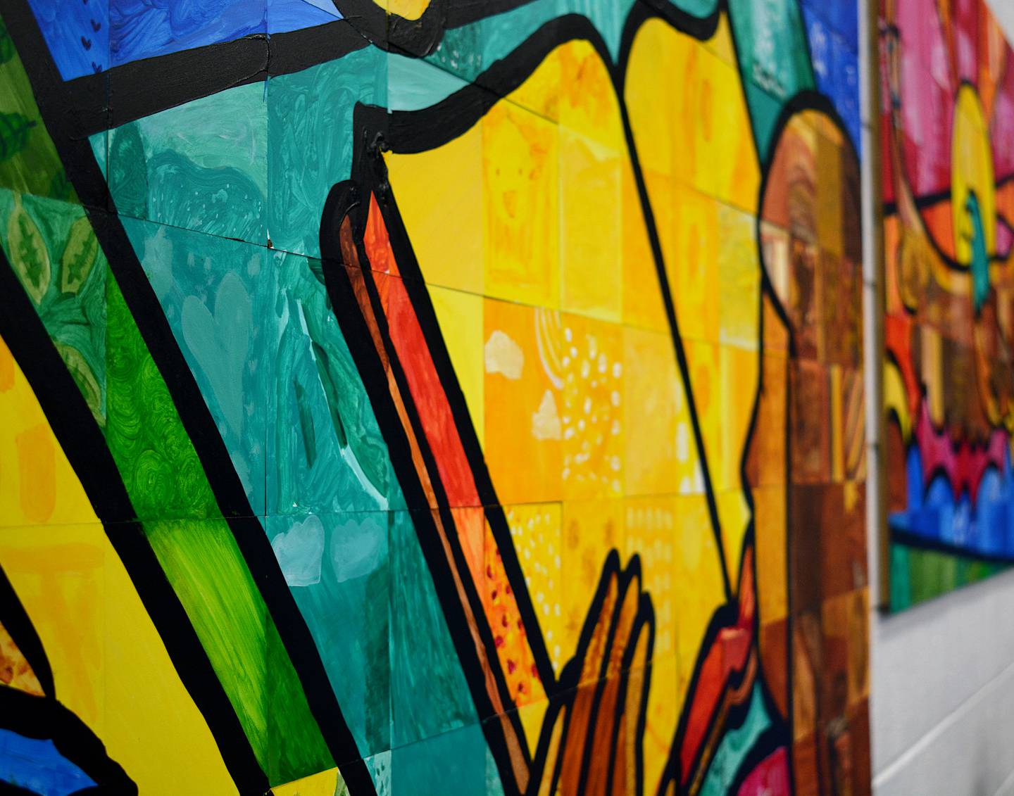 A close look at one of the murals. Each square was painted by a student or member of staff, giving them individual creativity before it is installed together as a completed mural.
