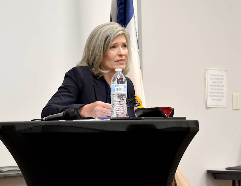 Ernst listens to Iowans' questions during a town hall meeting in Osceola.