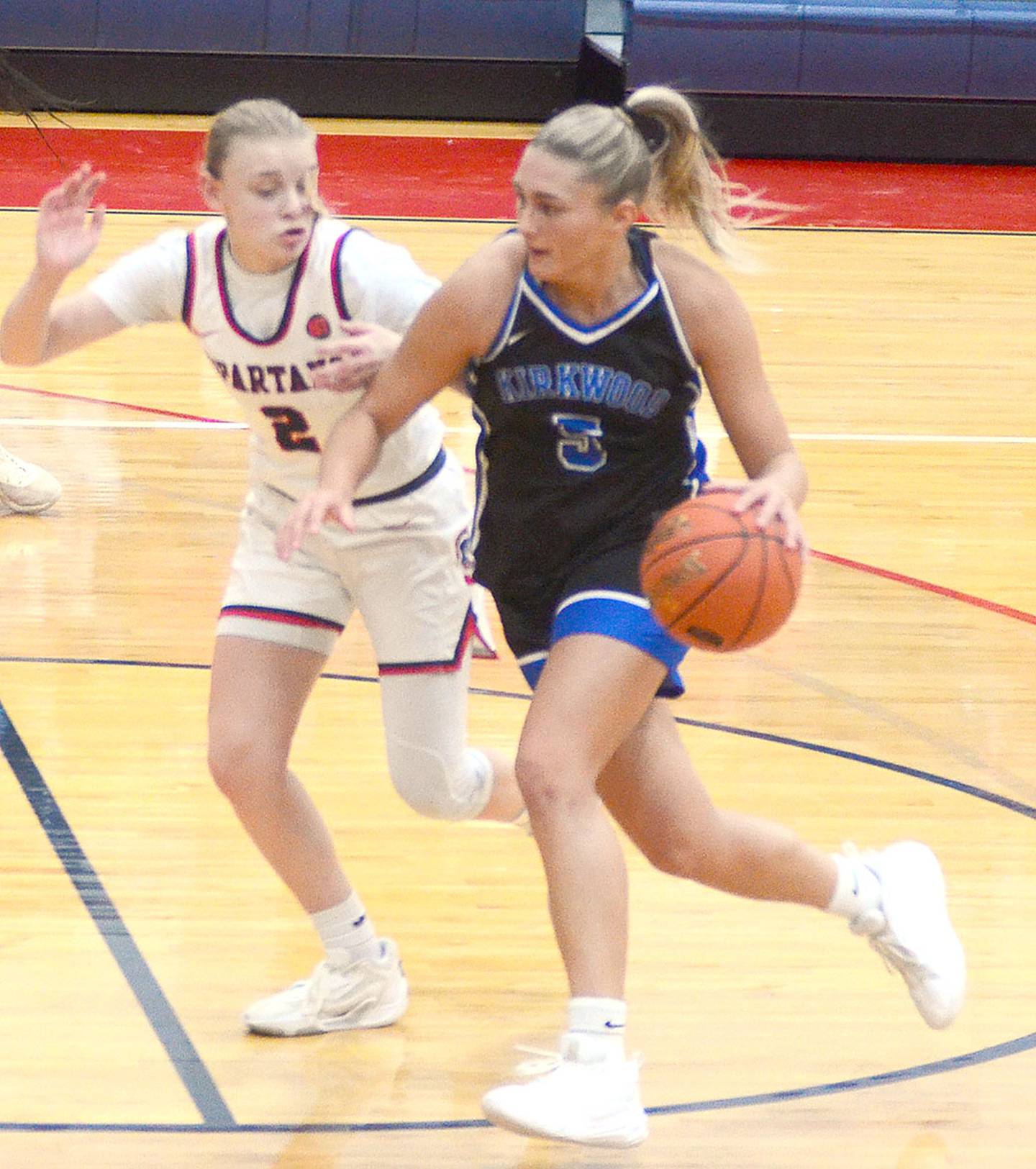 In a matchup of southwest Iowa preps, Southwestern's McKenna Wiechman of Griswold guards Kirkwood freshman Eva Steffensen of Anita during Saturday's game.