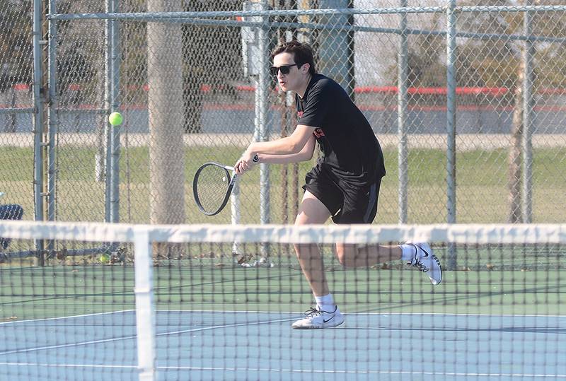 Creston No. 1 singles player Spencer Brown hustles to an approach shot during his match Tuesday against Red Oak. Brown and Wesley Wires fell in a tiebreaker doubles match to Red Oak's No. 1 doubles team.