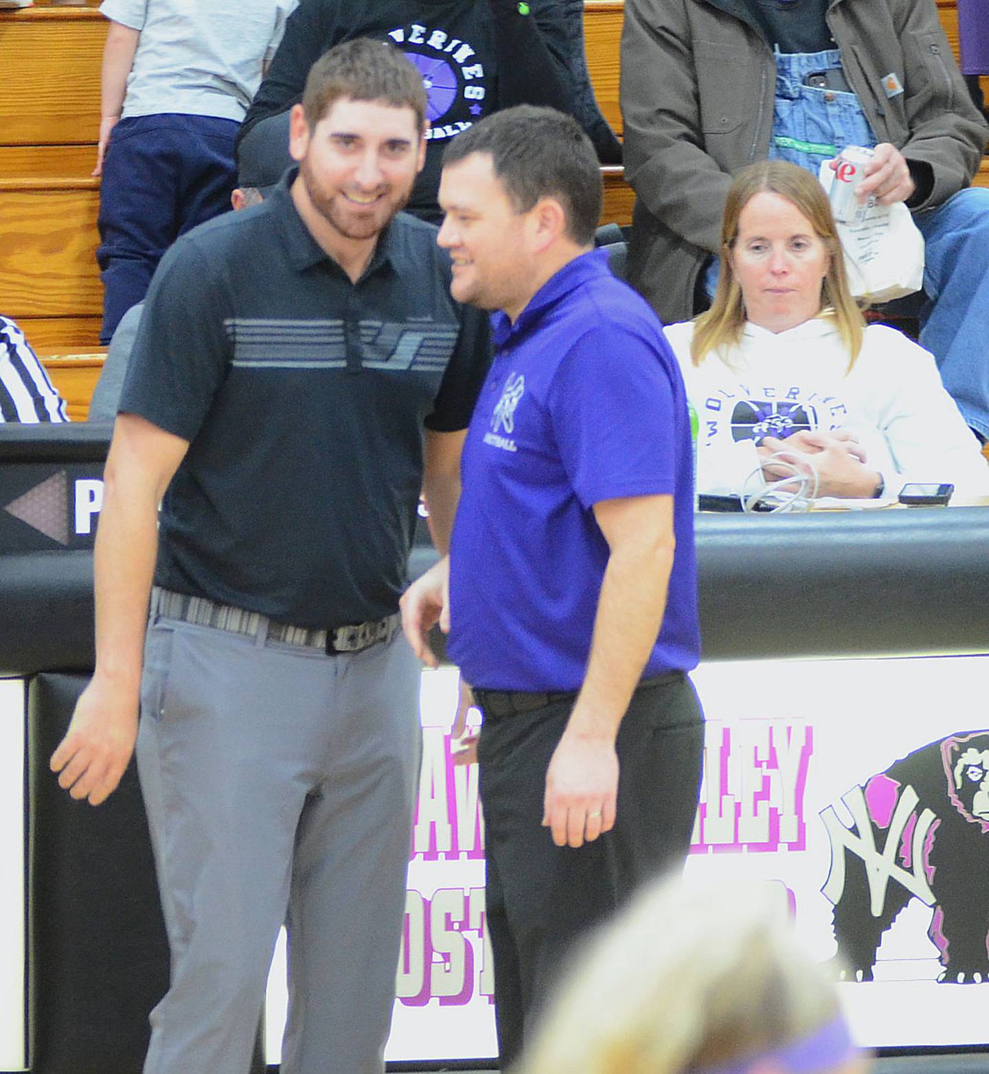 Lenox coach Michael West (left) and Nodaway Valley coach Thad Tussey meet to shake hands after the Tigers' 65-42 victory Tuesday. West and Tussey are former Orient-Macksburg teammates.