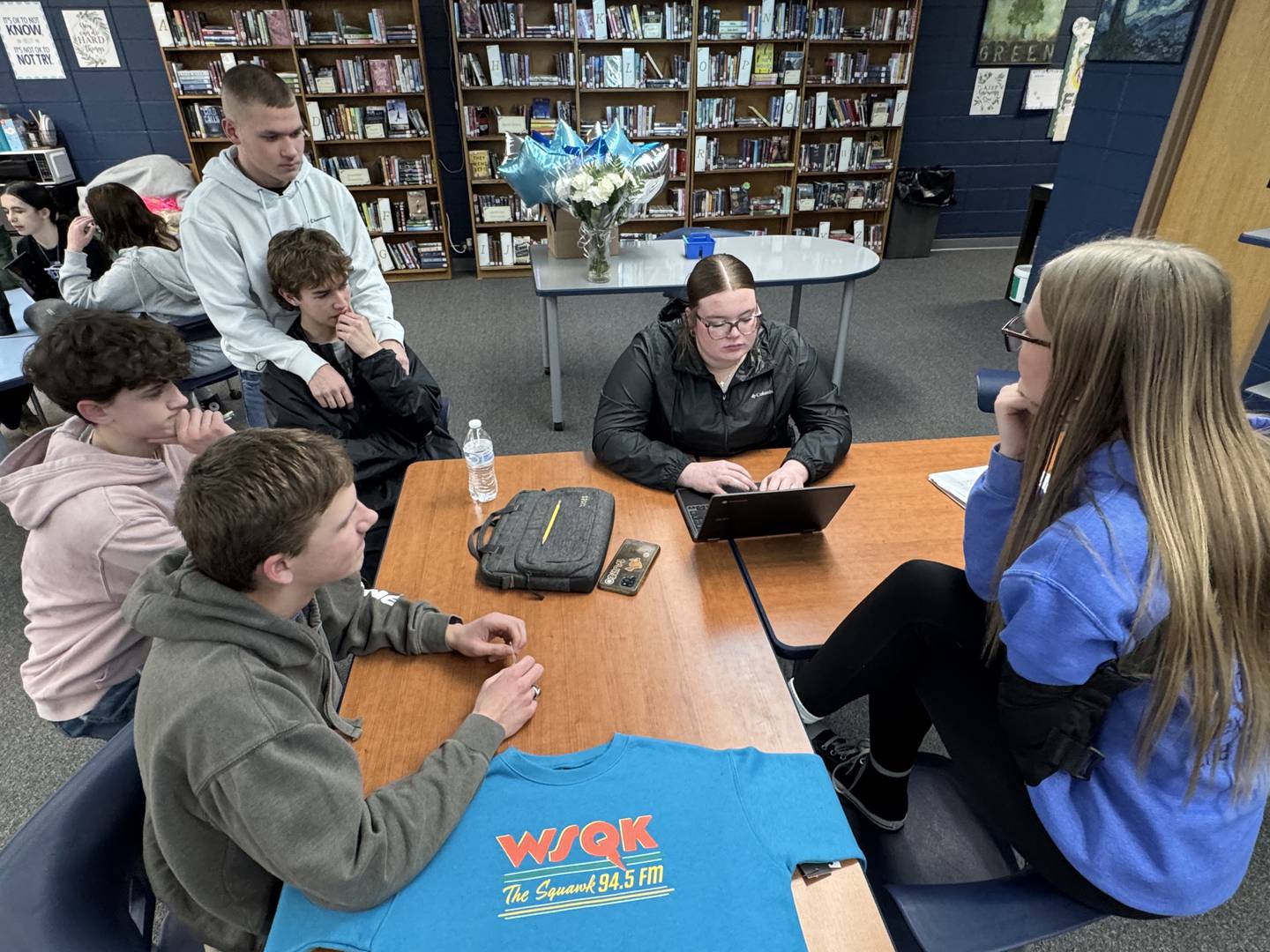 The television newscast group brainstorms ideas.