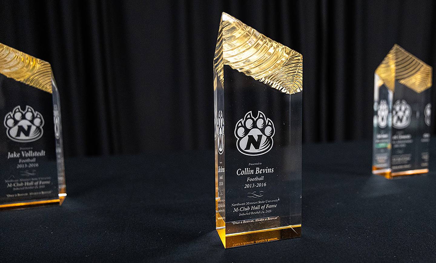 The plaque designating Collin Bevins as an M-Club Hall of Fame inductee is displayed at the induction banquet.